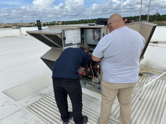 Teamwork makes the dream work. 
Wilmington HVAC techs hard at work.