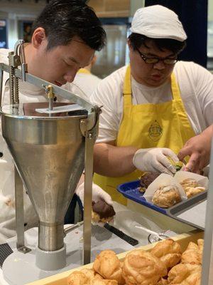 Filling the cream puffs