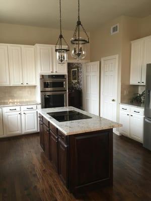 New cabinet drawer and door fronts and paint. Door fronts, drawer fronts and panels on island with dark stain and satin finis...