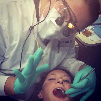 Dr budd helping his hygienist in need.