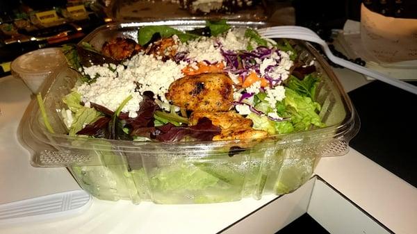 The Chicken Garden Salad comes in at under $9.00.  It includes tzatziki sauce and a slice of pita.