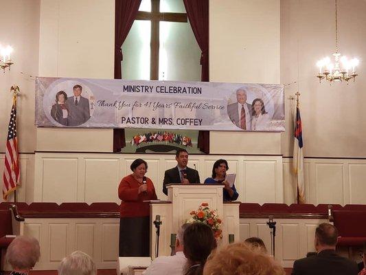 My family singing at the retirement service