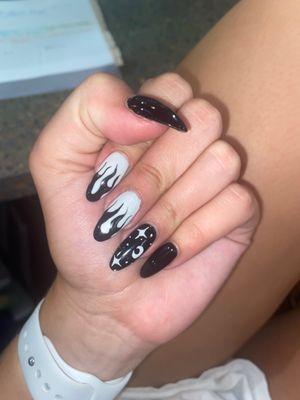 nails with black flames and white stars