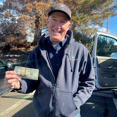 A Mill Street member shows off his donation to the Northern Nevada Children's Cancer Foundation during our Gig Game Grid Contest in 2023