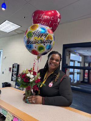 My wife with the incorrect balloon who didn't notice until one of her coworkers asked if it was her birthday or anniversary smh