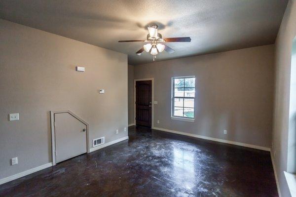 Sherrie Circle Living Room with stained concrete floors