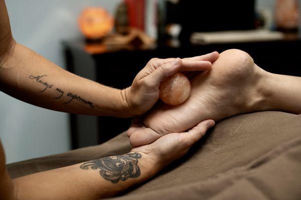 Hot salt globe during reflexology session