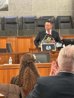 Attorney Amir Stark being recognized for his pro bono service