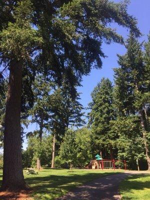 Beautiful small neighborhood city park with a playground, tennis court, basketball courts, bathrooms and several picnic tables.