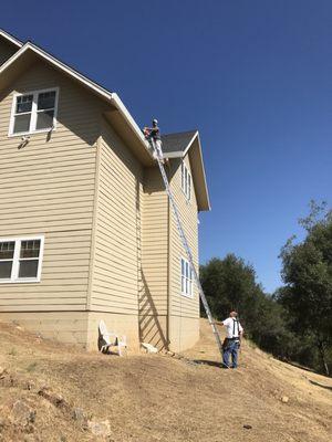 Gutter cleaning prior to covering, three stories up