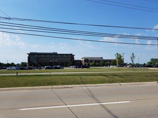 Turning left from 23 Mile Road into lot for medical building. Near corner of Romeo Plank