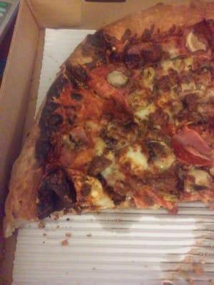 Burnt pizza and crust, they advertise cooked medium unless ordered otherwise. B S