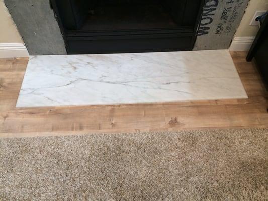 Solid 3/4" Calacatta Marble installed for our fireplace remodel - $575 fabricated and installed!