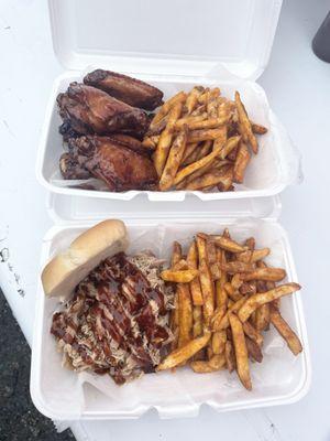 Honey garlic chicken wings and pulled chicken sandwich with seasoned fries.