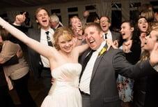 Kayla and Chris celebrate near the end of their wedding with Seattle Wedding DJ Alan Chitlik