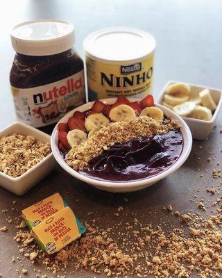 Can't go wrong with a classic Brazilian Acai Bowl! Topped with strawberry, banana, sweet condensed milk, granola, peanuts, & powdered milk!