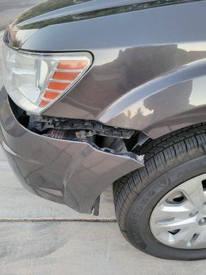 This is the damage from whatever hit the car while it was in a parking space (handicap, no less). I paid it on my own.