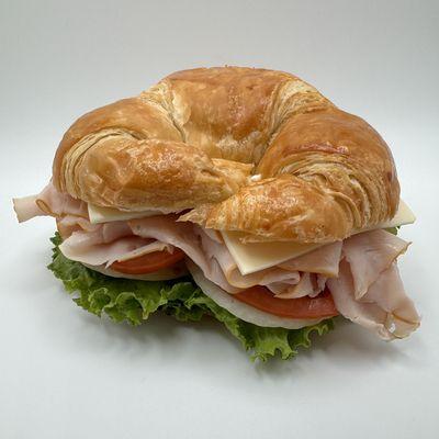 Turkey Croissant Sandwich - lettuce, tomato, onion, mayo, mustard, swiss cheese