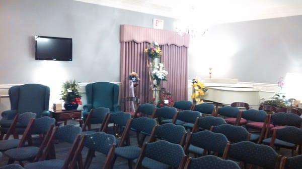 Our main chapel set up for a service. The white, baby grand piano in the corner can be used for any service.