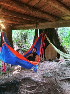 The hubby chilling under the tree house