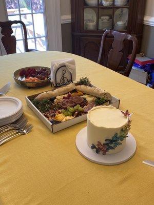 Perfect cake with charcuterie tray.