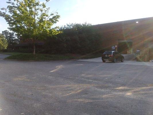 Car parked in the dock area. Signs say "No Parking."