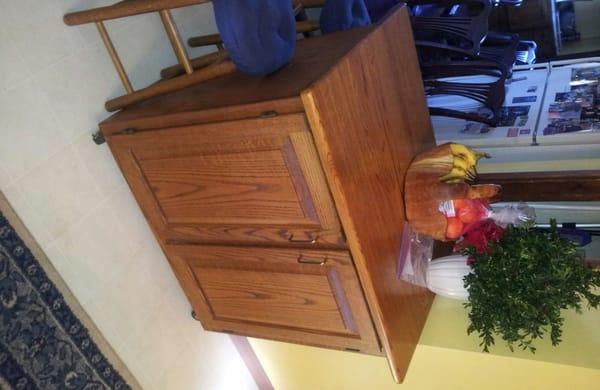 Kitchen island on locking wheels with two raised panel doors on each side.Made of red oak.Measures 36" tall 36" long and 24" wide.