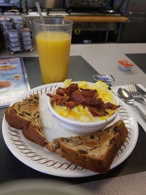 Breakfast bowl with grits, eggs, bacon & cheese and raisin toast on the side