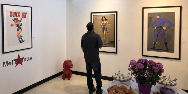 A collector exploring the Mel Ramos and Gary Dinnen exhibition.