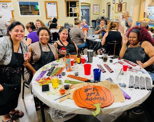 Friends getting together to paint Halloween Yard Art at the Roseville Moose Lodge