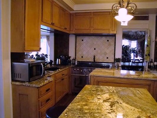 Stained maple shaker kitchen with rolling islands