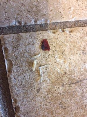 Bathroom floor, food and nail clippings