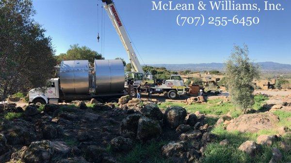 Delivery and installation of two 5,000 gallon stainless steel storage tanks.