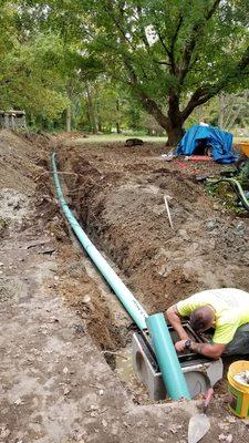 New 6" pipe... a water superhighway going one way... way away from my house!  Awesome!