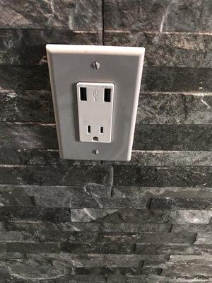 Charging outlets with USB ports throughout the bar.