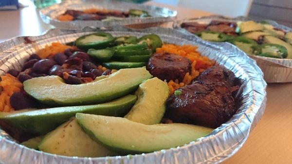 Custom platter--rice and beans, jalapeño, avocado, maduros, side of green sauce