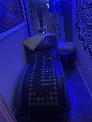 Relaxation area with infrared heated pad infused with jade & black tourmaline crystals