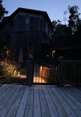 The main house, bridge to pool, creek on property, common/breakfast area, and grounds.