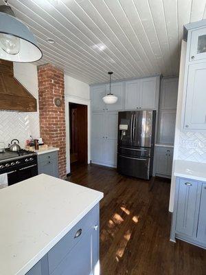 Uncovered original chimney and floors in our Craftsman house