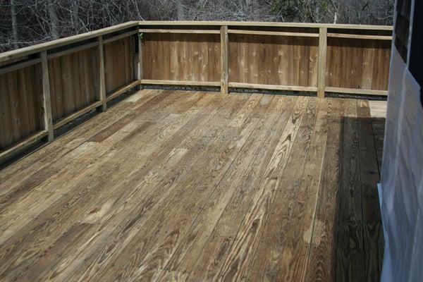 Deck after cleaning and wood sealant application.