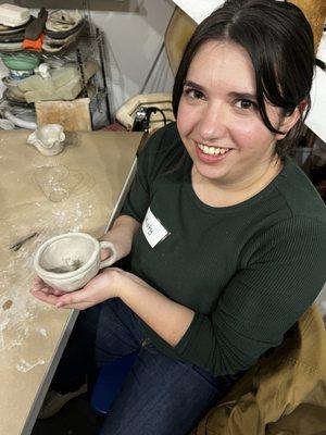 Student with her pottery mug