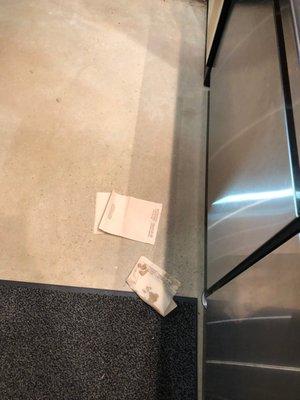 Napkins and trash on floor