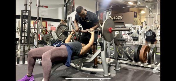 Building upper body strength using the classic barbell bench press (135lbs)