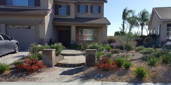 Flagstone walkway and drought tolerant landscaping.