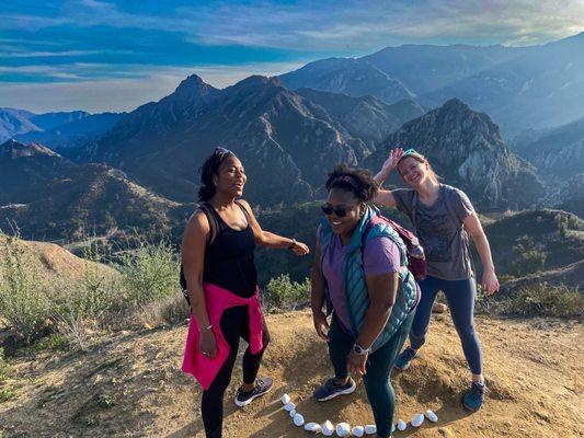 Hikers having fun enjoying the most beautiful hikes and views in Malibu and Los Angeles, California on a birthday present hiking experience!