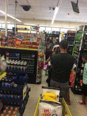 Long line of people and they still won't open the other register