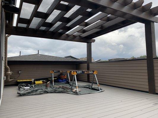 Custom pergola screen installing.