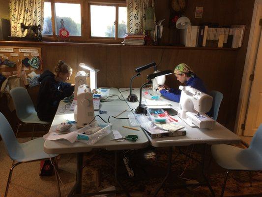 Students learn to sew in small classes