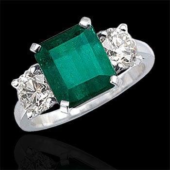 Emerald and diamond ring set in platinum.