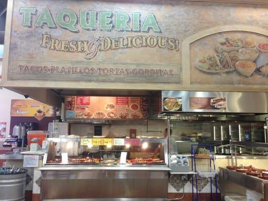 Kitchen inside the market with very fresh ingredients.